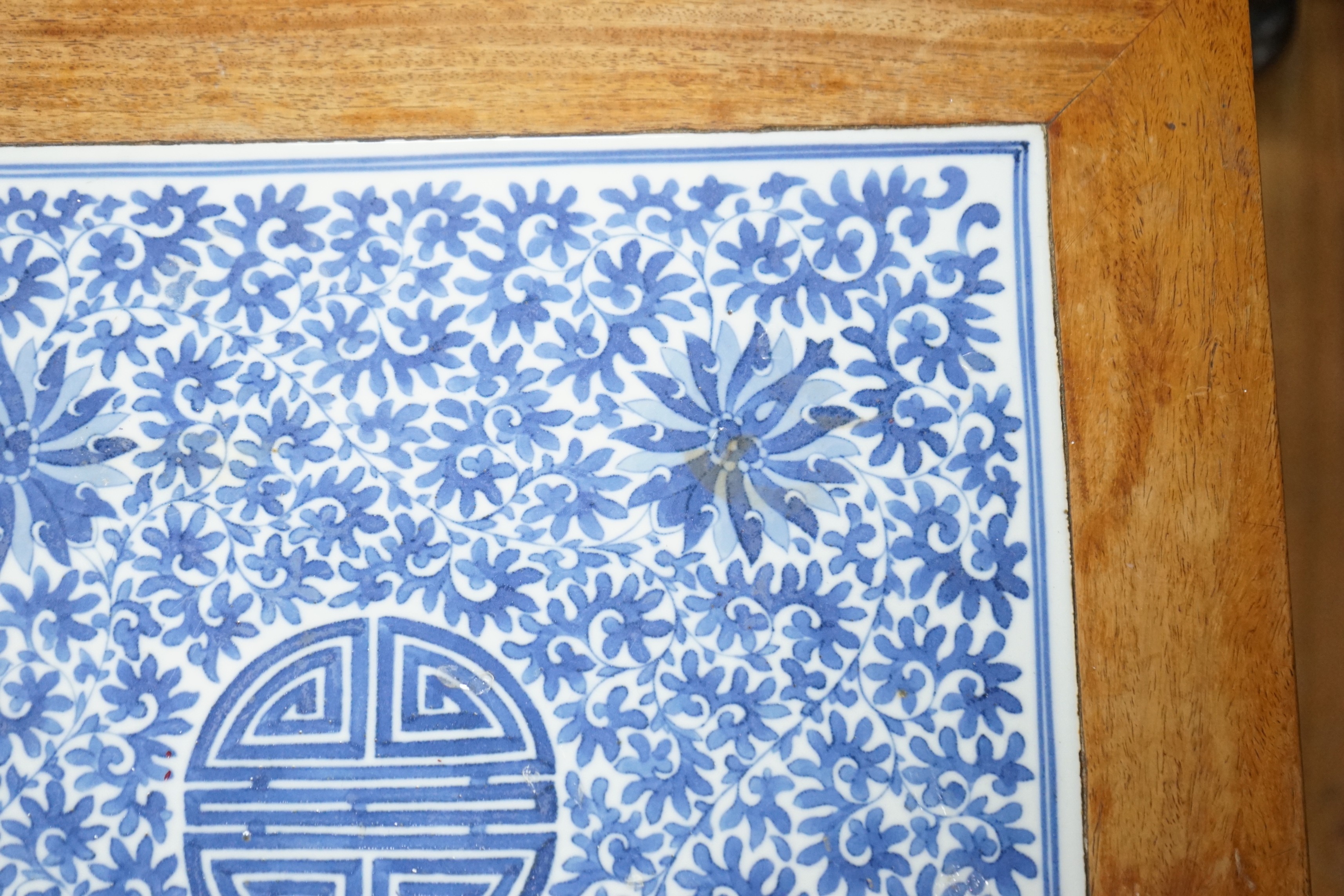 A Chinese hardwood and underglaze blue porcelain tile inset table, width 42cm, depth 42cm, height 43cm